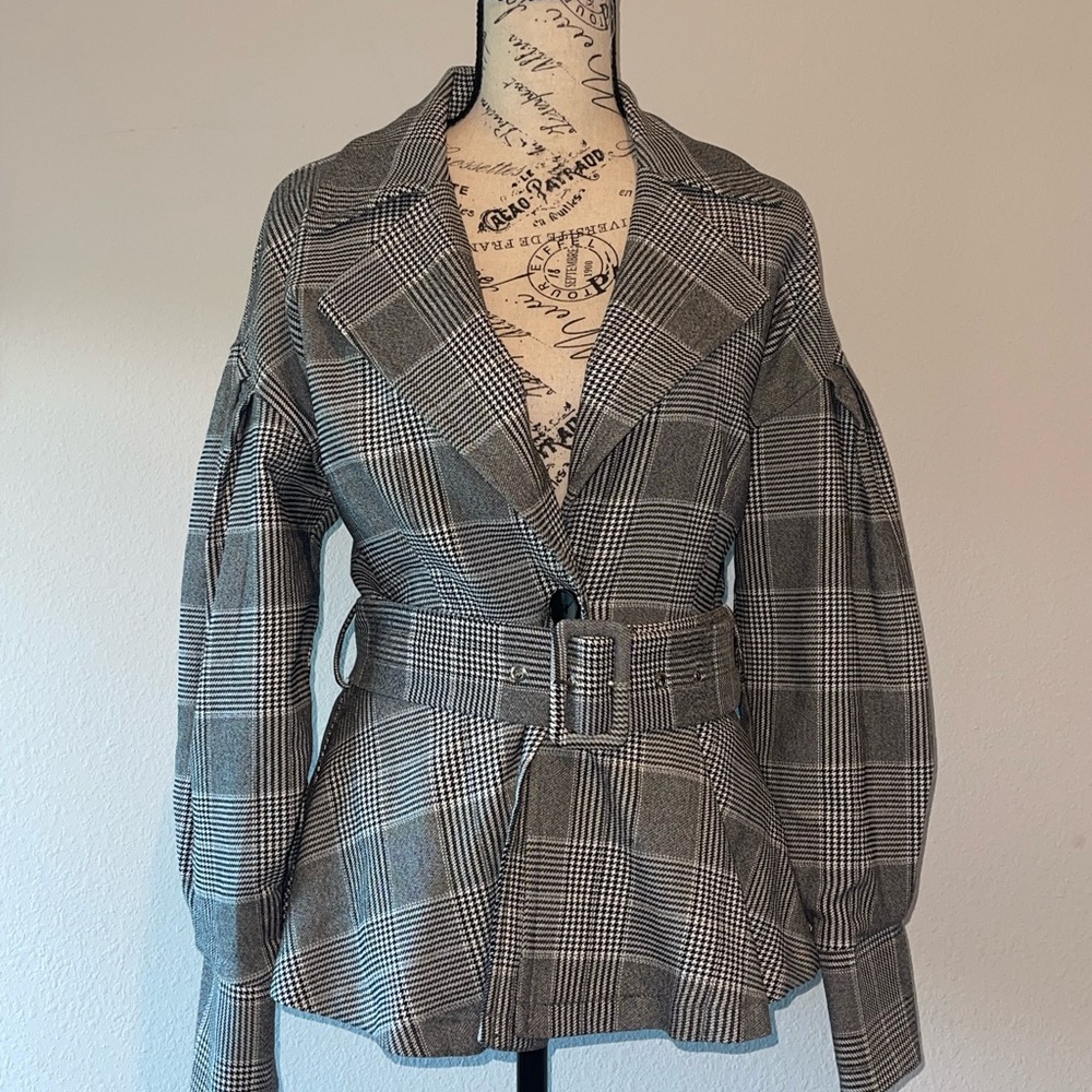 Houndstooth peplum coat